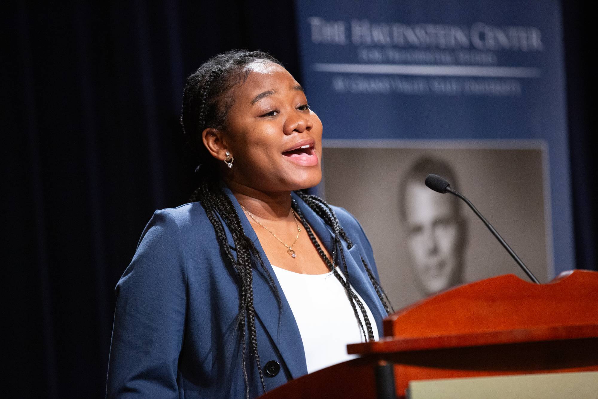 a student talks at the podiium